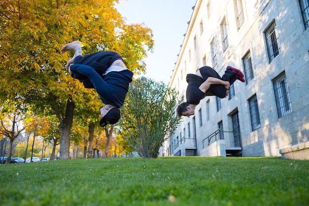 Young people doing a parkour jump