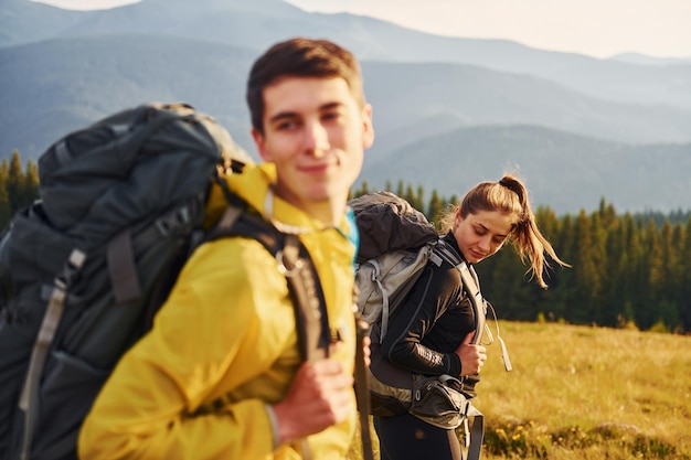 Young people enjoying Majestic Carpathian Mountains Beautiful landscape of untouched nature