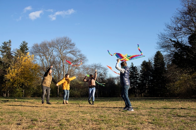 Young people getting their kite up