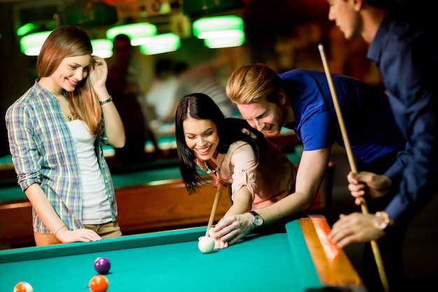 Young people playing pool