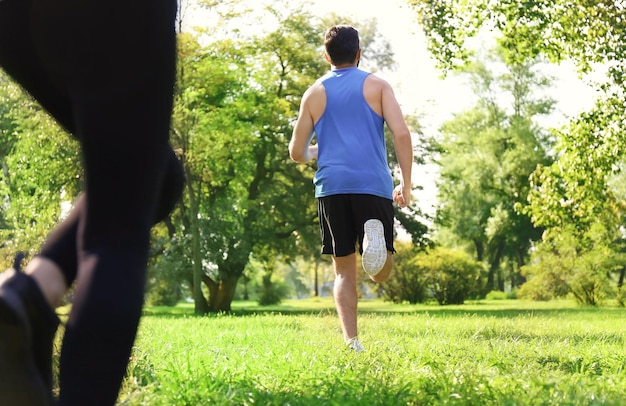 Young people running in park