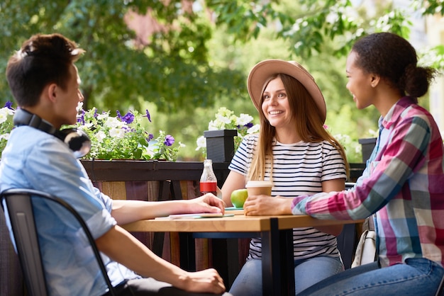 Young People talking at Cafe Table