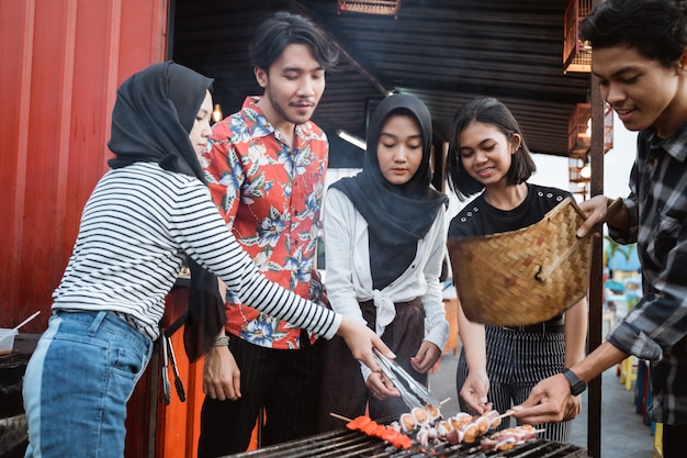 Young people together celebrate the outdoor party