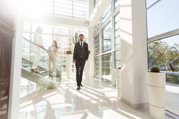 Young people walking in the office