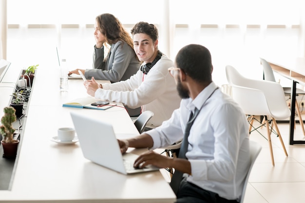 Young people working and resting in coworking space