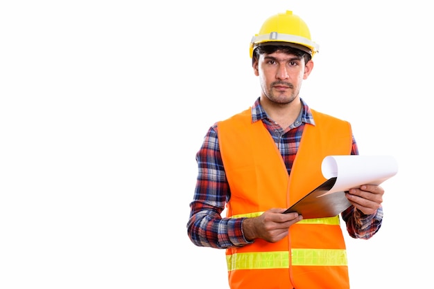 Young Persian construction worker holding clipboard