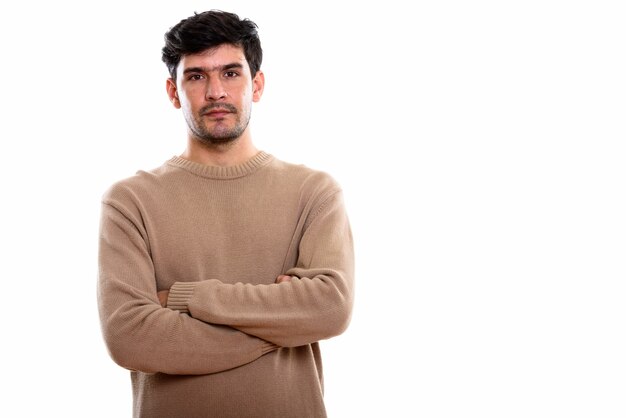 young Persian man with arms crossed