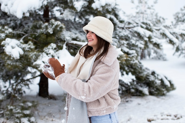 Young person having fun in the snow