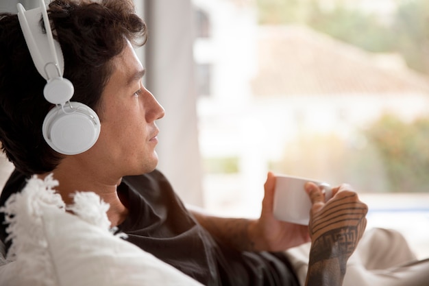 Young person relaxing while listening to music