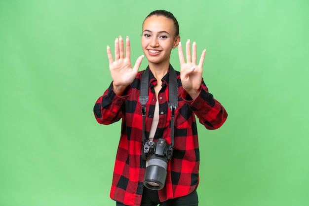 Young photographer Arab woman over isolated background counting nine with fingers