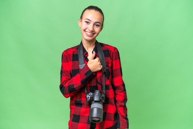 Young photographer Arab woman over isolated background giving a thumbs up gesture