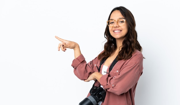 Young photographer woman over isolated white