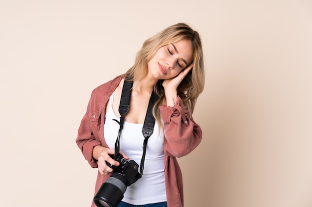 Young photographer woman with camera