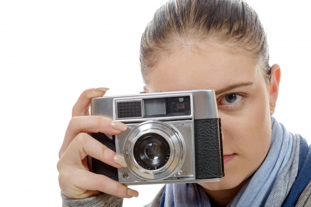 young photographer woman with a vintage camera