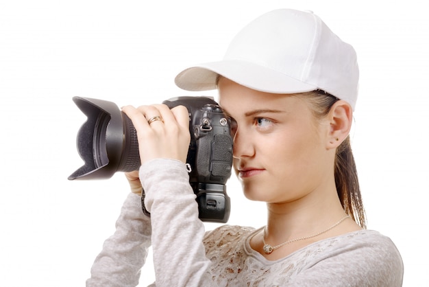 Young photographer woman with white cap