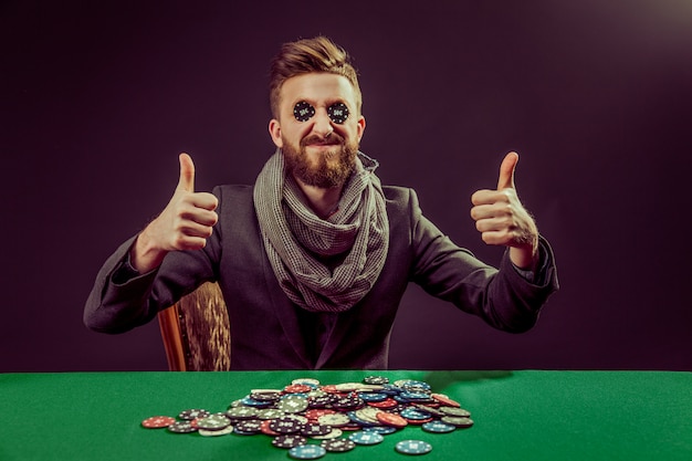 Young pocker player with thumbs up