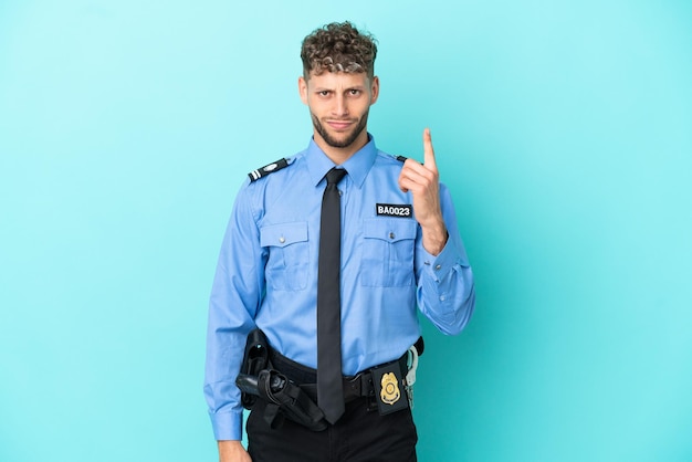 Young police blonde man isolated white on blue background pointing with the index finger a great idea