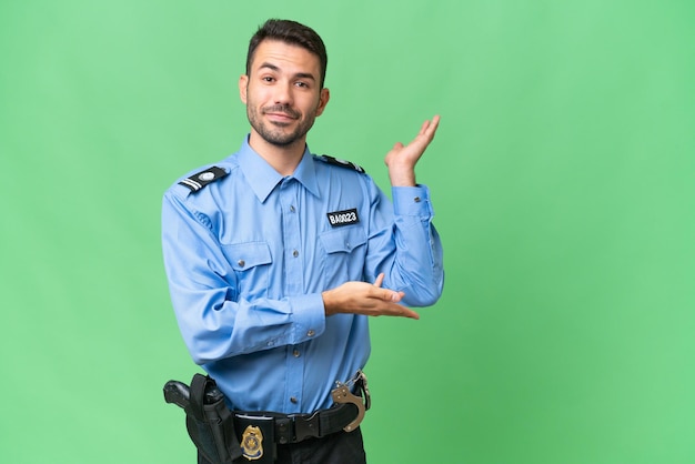 Young police caucasian man over isolated background extending hands to the side for inviting to come