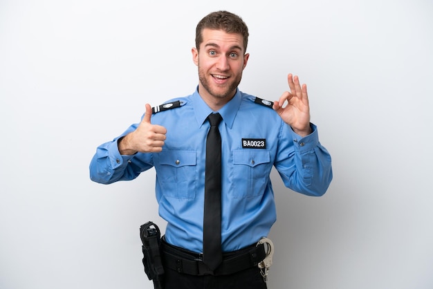 Young police caucasian man isolated on white background showing ok sign and thumb up gesture