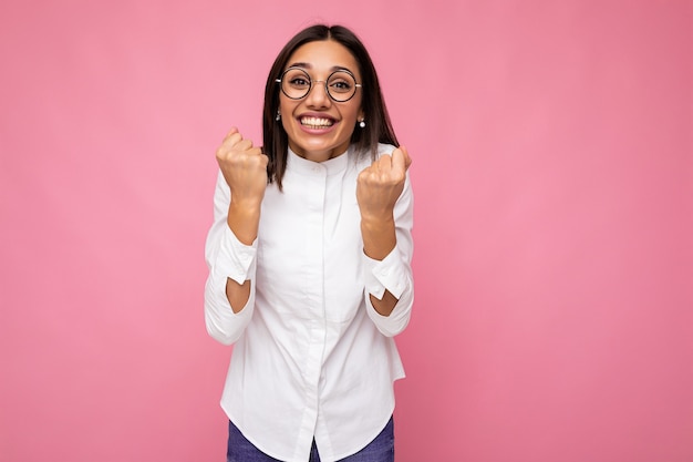 young positive happy smiling beautiful woman with sincere emotions wearing stylish clothes