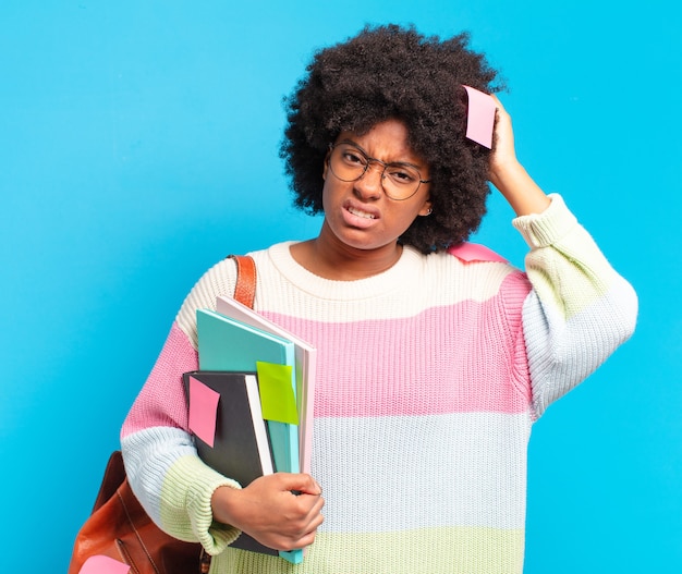 Young pretty afro student woman