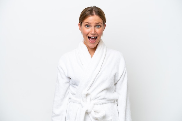 Young pretty blonde woman in bathrobe isolated on white background with surprise facial expression