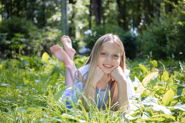 Young pretty girl laying on the grass