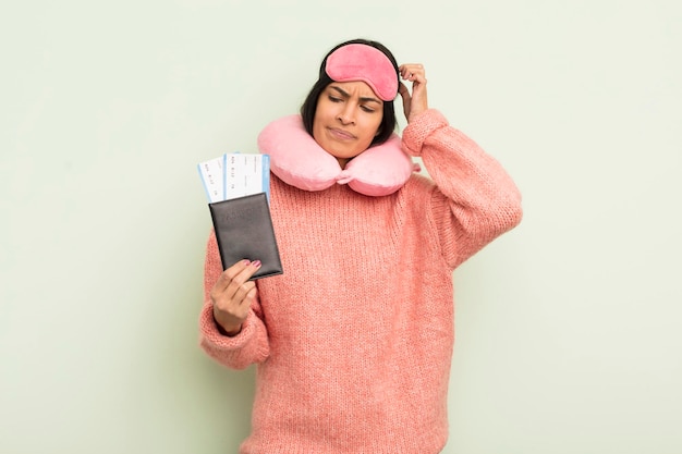 Young pretty hispanic woman flight passenger concept