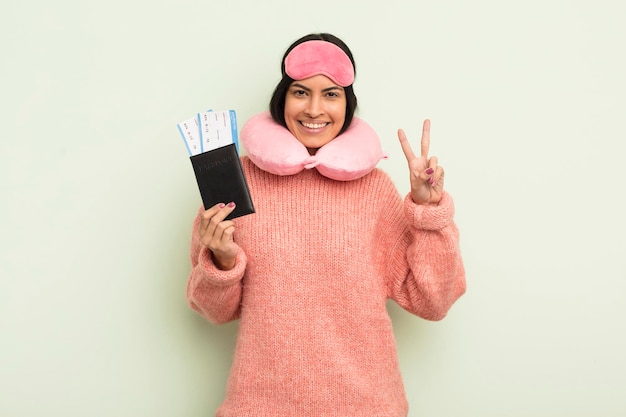 Young pretty hispanic woman flight passenger concept