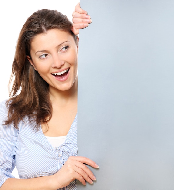 a young pretty woman holding a banner over white background