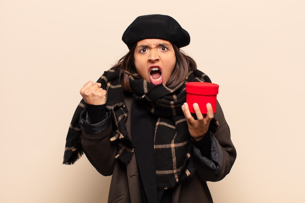 Young pretty woman holding a gift