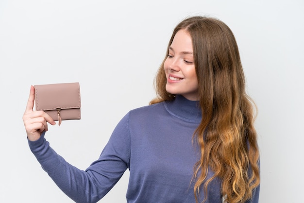 Young pretty woman holding wallet isolated on white background with happy expression