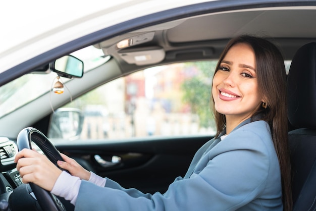 Young pretty woman inside a car