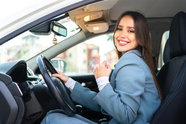 Young pretty woman inside a car