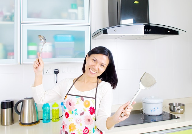 Young pretty woman in the kitchen