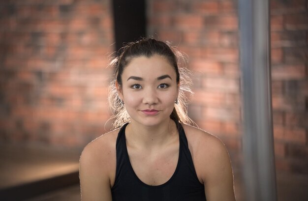 Young pretty woman in sport clothes Looking in the camera Portrait