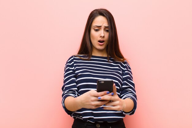 Young pretty woman using her smart telephone