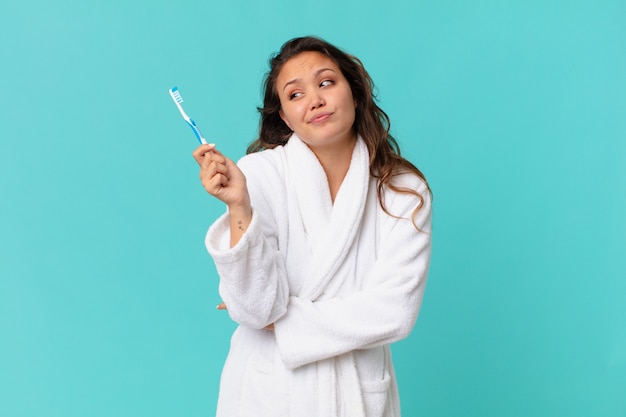 Young pretty woman wearing bathrobe