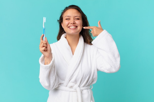 Young pretty woman wearing bathrobe