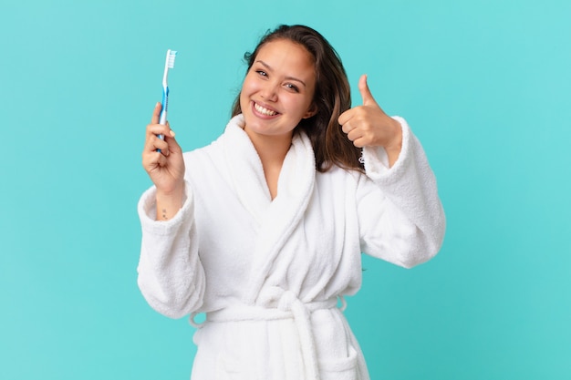 Young pretty woman wearing bathrobe