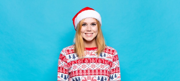 Young pretty woman wearing Christmas clothes