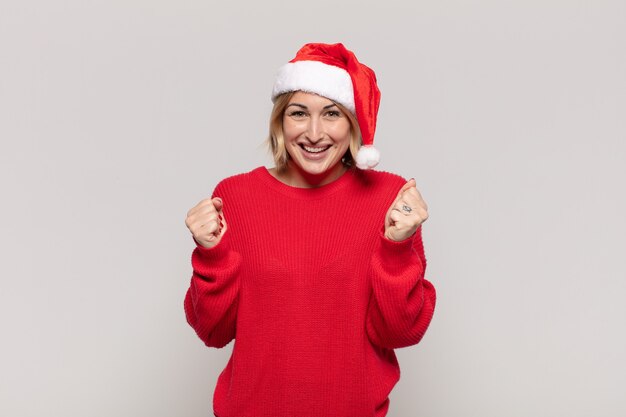 Young pretty woman wearing Christmas clothes