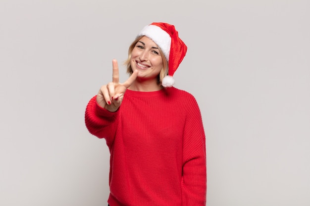 Young pretty woman wearing Christmas clothes