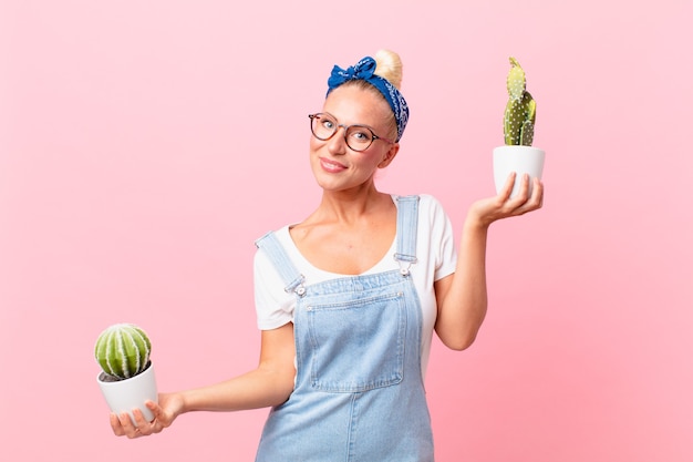 Young pretty woman with a house plant