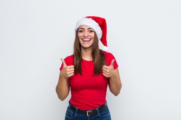 Young pretty woman with santa hat. Christmas concept. 