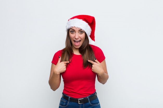 Young pretty woman with santa hat. Christmas concept. 