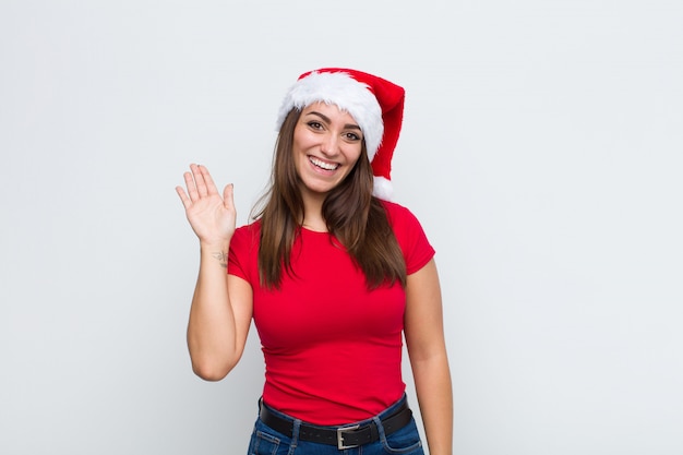 Young pretty woman with santa hat. Christmas concept. 