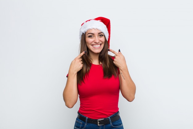 Young pretty woman with santa hat. Christmas concept. 