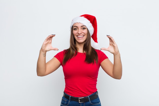 Young pretty woman with santa hat. Christmas concept. 