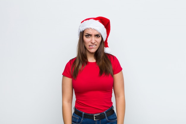 Young pretty woman with santa hat. Christmas concept. 